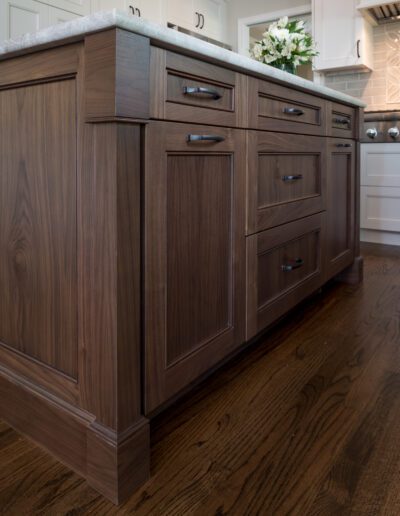 A kitchen with hardwood floors and a center island.